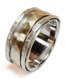 silver and gold spinning rings by Colette Hazelwood