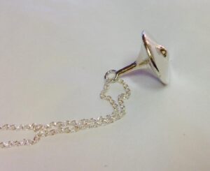 spinning top necklace silver